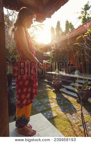 Woman Holding Canang Sari - Offering For Gods. Balinese Tradition.