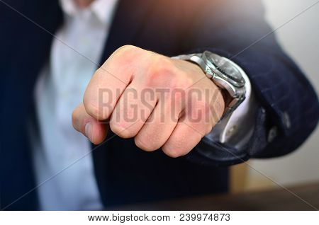 Bold Businessman Making A Fist Hit . Concept Of Determination And Punch.