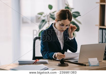 View Of Female Lawyer At Workplace In Office