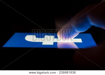 Moscow, Russia - May 9, 2018: A Smartphone Lying On A Table In The Dark, Displaying The Logo Of The 