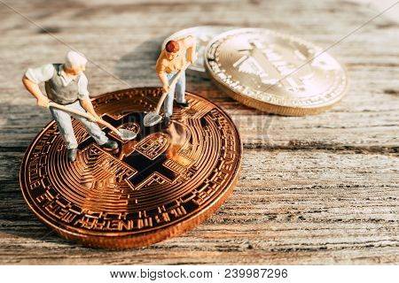 Bitcoin Mining Miniature People Diging On Valuable Coin Wood Background
