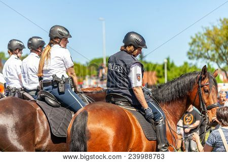 Delmenhorst / Germany - May 6, 2018: German Police Horsewoman Rides On A Police Horse For Training E