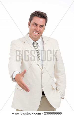 Cheerful Businessman Outstreching His Arm To Handshake