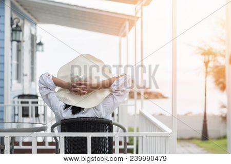 Summer Vacation Lifestyle With Young Girl Wearing Sunscreen Hat On Sunny Day Relaxing Taking It Easy