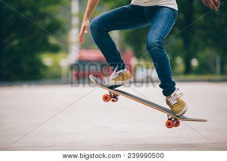 One Young Skateboarder Sakteboarding On Parking Lot