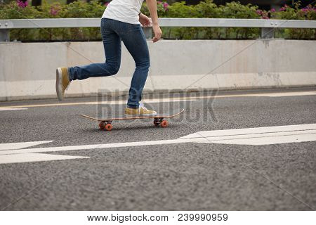 One  Young Woman Skateboarder Sakteboarding On Highway