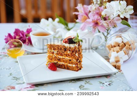 Tasty Oldfashioned Cake With Cream Icing Served With Tea And Raw Apples On Shabby Turquoise Table.