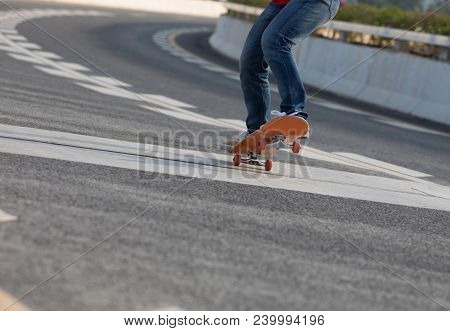 One Young Woman Skateboarder Sakteboarding On Highway