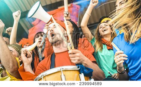 Fan Supporters Friends Cheering And Watching Soccer Cup Match At Intenational Stadium - Young People