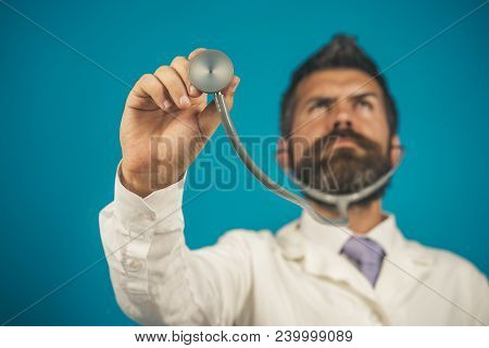 Healthcare, Healthy Lifestyle And Medicine Concept - Medical Bearded Doctor With Stethoscope In Hand