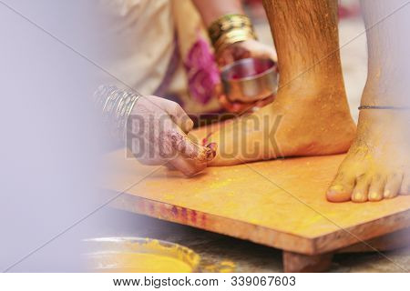 Indian Traditional Wedding: Haldi Ceremony, Women Hand Putting Turmeric