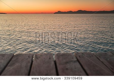 Pier By The Sea In Sunrise Morning Light