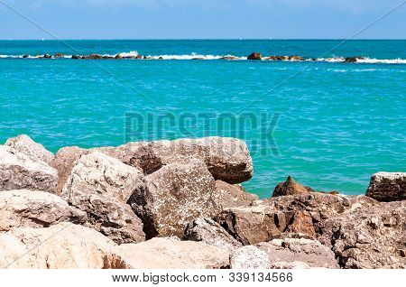 Massive Stones Rocks Lying On The Beach As A Border Between Pebble Beach Spiaggia Del Frate And Adri