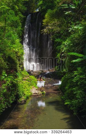 Woman near Labuhan Kebo Waterfall located in Munduk, Bali