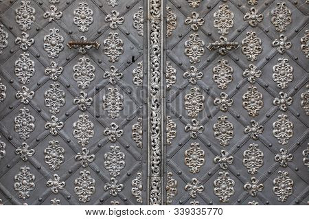 Close Up Of Iron Door Of St. Nicholas Church In Prague, Czech Republic. Details And Handles Of Iron 