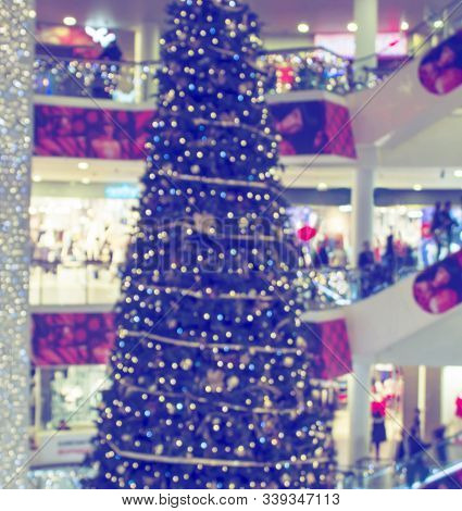 Сhristmas Tree In Shopping Mall, Defoused Holiday Background.