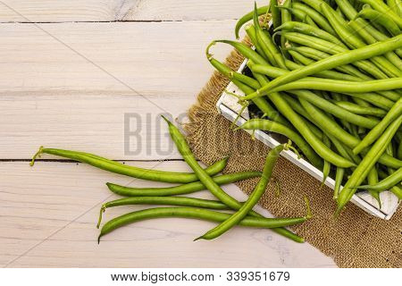 Phaseolus Vulgaris, Green Common Bean Or Kidney Bean In Wooden Box