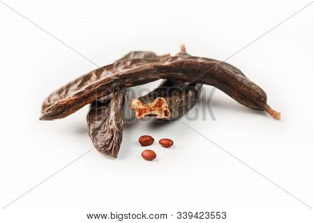 Carob Carob Fruit And Seeds On White Background. Isolate.