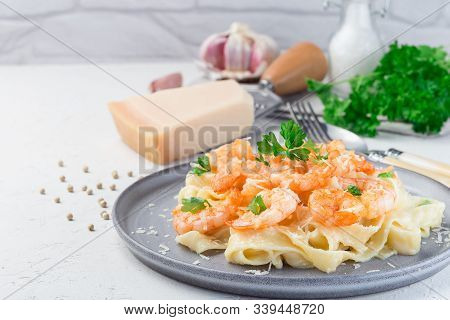 Pasta With Shrimps In Creamy Parmesan Cheese And Garlic Sauce Garnished With Parsley, Fettucini Alfr