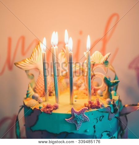 Lighting Candles On Birthday Cake. Birthday Party. Make A Wish. A Beautiful Buttercream Cake Decorat