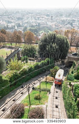 Upper City Funicular Line In Bergamo (funicolare Citta Alta). Red Funicular Connects Old Upper City 
