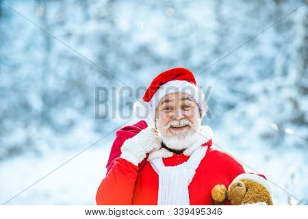Delivery Christmas Gifts. Winter Christmas Greeting Card. Santa Claus With Big Bag. Santa Claus With