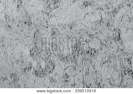 Wall Plaster Texture. The Photo Is Monochrome, Blurry.