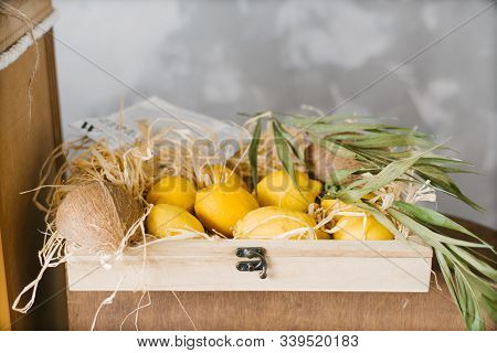 Exotic Fruit Lemons In A Wooden Box. Copy Space