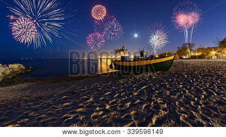 Happy New Year Fireworks Over Baltic Sea On The Beach In Gdynia. Poland, Europe