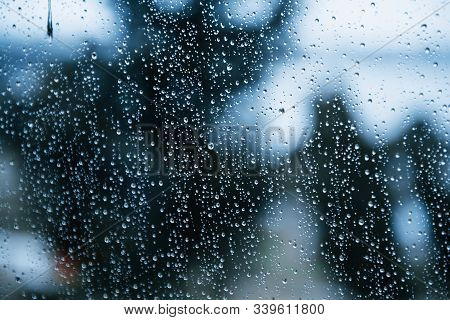 Waterdrops On The Clean Glass. Window And Rainy Day. Close Up View.