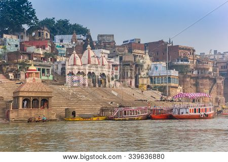 Varanasi, India - November 07, 2019: Temple And Boats At The Scindia Ghat In Varanasi, India