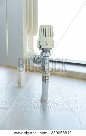 Thermostat Valve On White Radiator Close Up