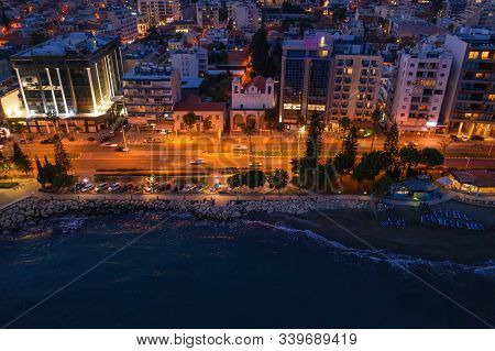 Aerial View Of Limassol Cityscape, First Coastline Buildings In Cyprus At Night. Drone Photo Of Medi