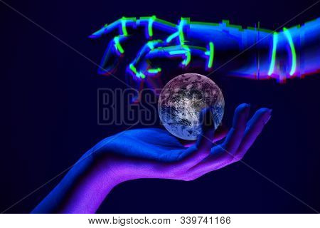 Earth Between Woman And Robots Hands As Symbol Of Partnership Between People And Technology For Save