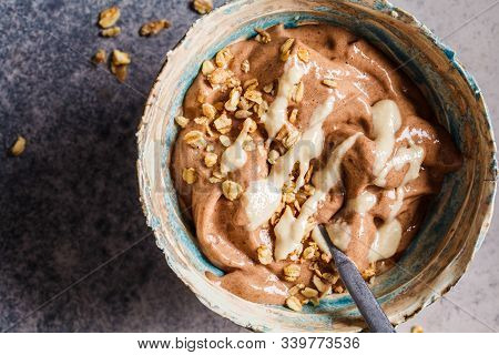 Vegan Breakfast. Chocolate Banana Nicecream With Granola And Peanut Butter.