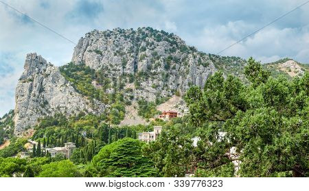 Rocky Mountain Range Overgrown With Single Trees And Seaside Village At His Foot, Old Juniper Tree O