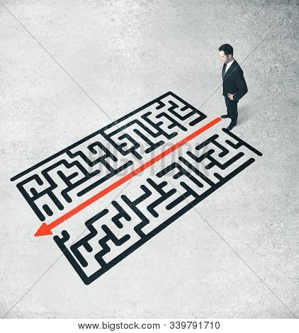 Businessman Looking On Red Arrow In Drawing Labirinth. Success And Startup Concept.