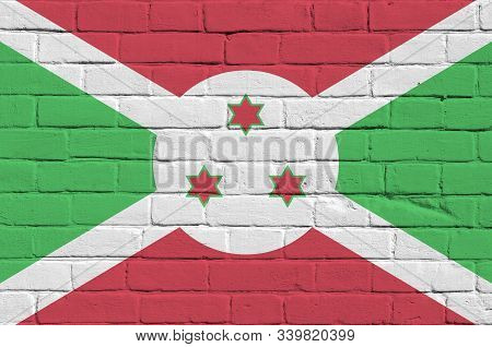 Burundi Flag Depicted In Paint Colors On Old Brick Wall. Textured Banner On Big Brick Wall Masonry B
