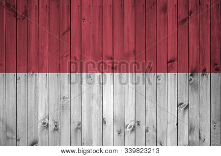 Indonesia Flag Depicted In Bright Paint Colors On Old Wooden Wall. Textured Banner On Rough Backgrou