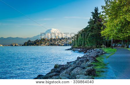 A View Of Mount Rainier And The Shoreline In Ruston, Washington.