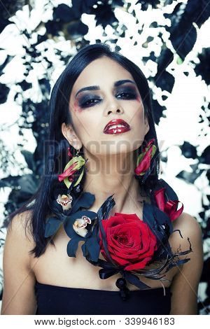 Pretty Brunette Woman With Rose Jewelry, Black And Red, Bright Make Up Kike A Vampire Closeup Red Li