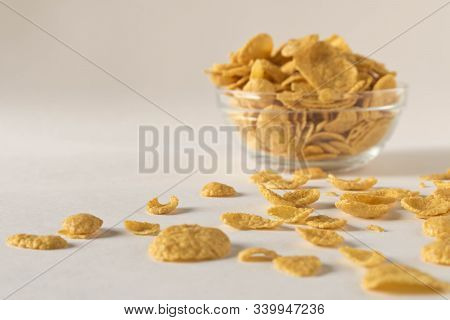 Cornflakes In A Plate On A Light Background. Selective Focus