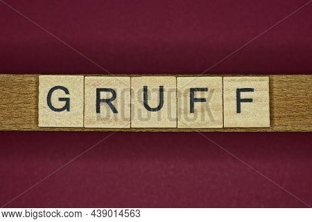 Word Gruff In Small Wooden Letters On A Pink Background