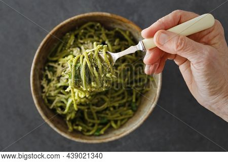 Eating A Bowl Of Spaguetti. Hand With A Fork Having The Meal.