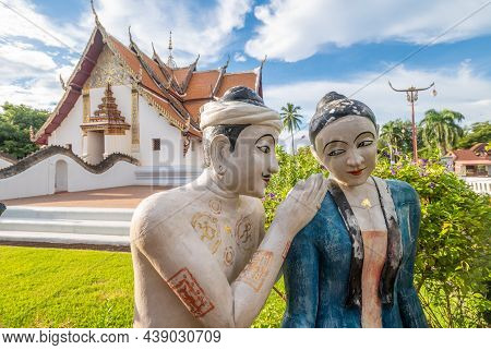 Nan Province, Thailand -  09/09/2020 : The Sculpture Of Lanna Peoples In Front Of Beautiful Viharn I