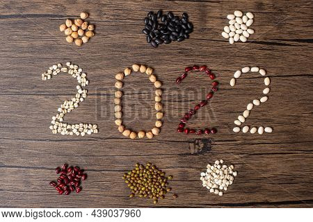 2022 New Year And New You With Organic Beans; Red, Black, White, Green, Chickpeas And Adlay On Table