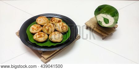 Closeup Of Indian Traditional Dish Kuzhipaniyaram Served With Coconut Chutney Isolated In A White Ba
