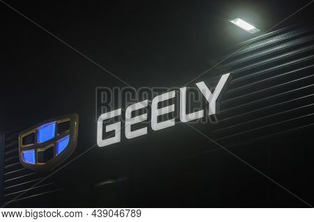 Geely Logo On Car Dealership Building At Foggy Night - Geely Is One Of The Largest Chinese Automobil