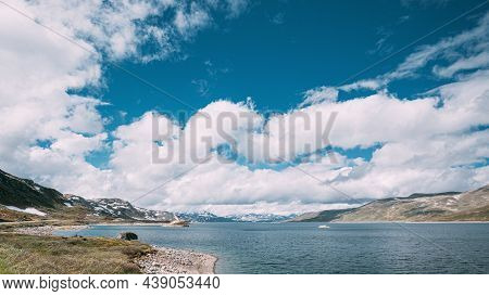 Oppland, Tyin Lake, Norway. Stones On Coast Of Beautiful Lake Tyin In Summer Day. Norwegian Nature. 