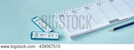 Shnelltest, Rapid Corona Test In German Language. Weekly Planner, Calendar, Pencil And Small House P